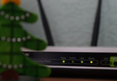 white and black modem router with four lights
